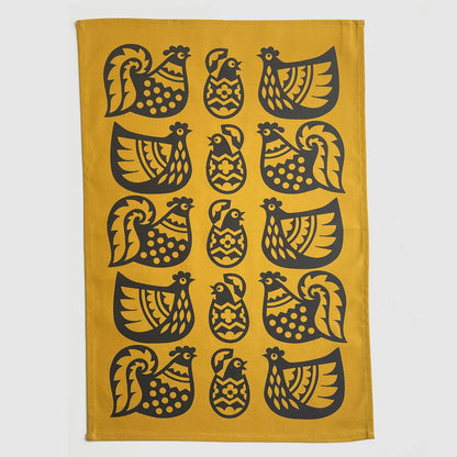 Magpie x Hornsea yellow tea towel with a pattern of black chickens and eggs