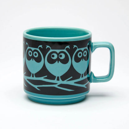 Magpie x Hornsea teal mug with a black band of teal owls on a branch