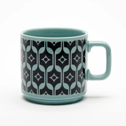 Magpie x Hornsea Heirloom mug in teal with a black geometric pattern
