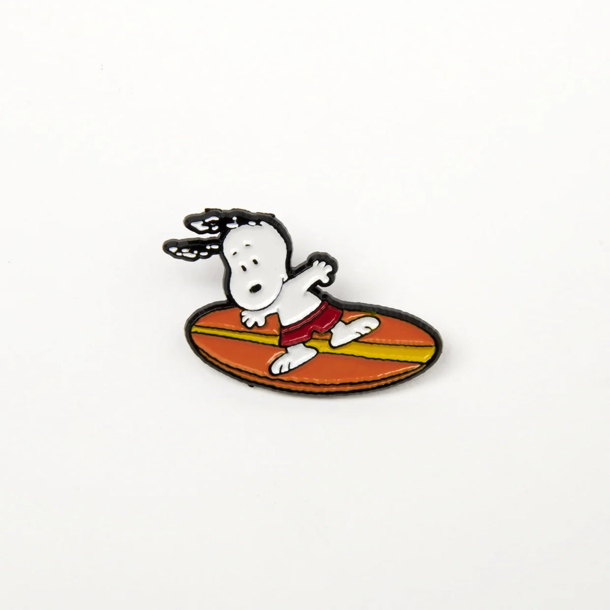 Snoopy surfing enamel pin, close-up