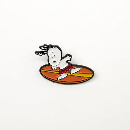 Snoopy surfing enamel pin, close-up