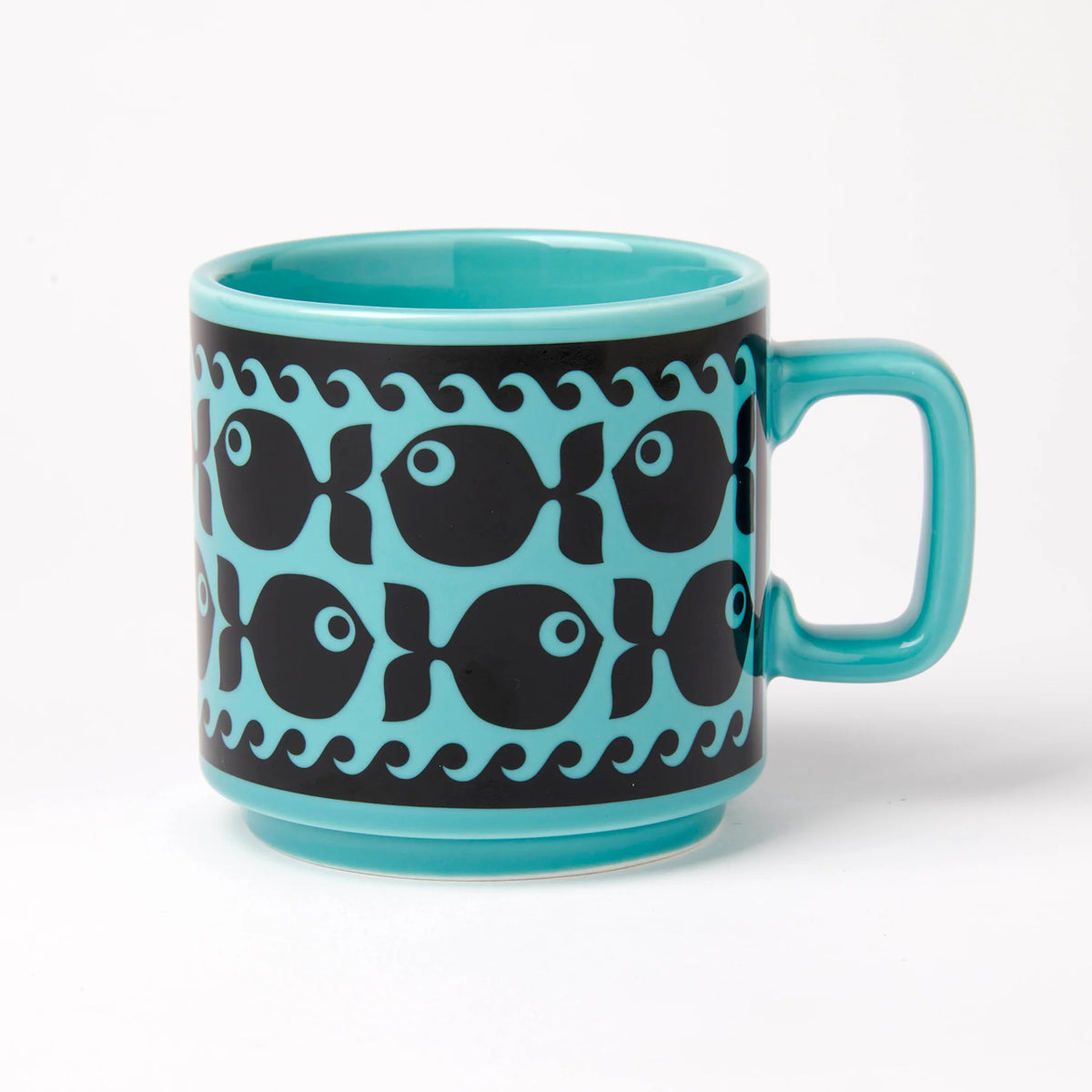 Magpie x Hornsea teal mug with a band of black fish and waves