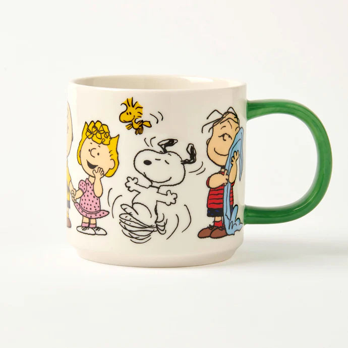 Peanuts Friends Forever mug: Snoopy dancing with Woodstock, Linus and Sally, with a green handle