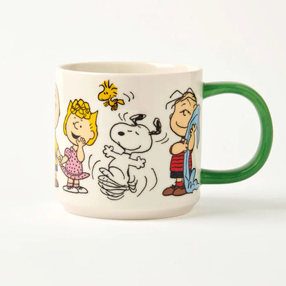 Peanuts Friends Forever mug: Snoopy dancing with Woodstock, Linus and Sally, with a green handle