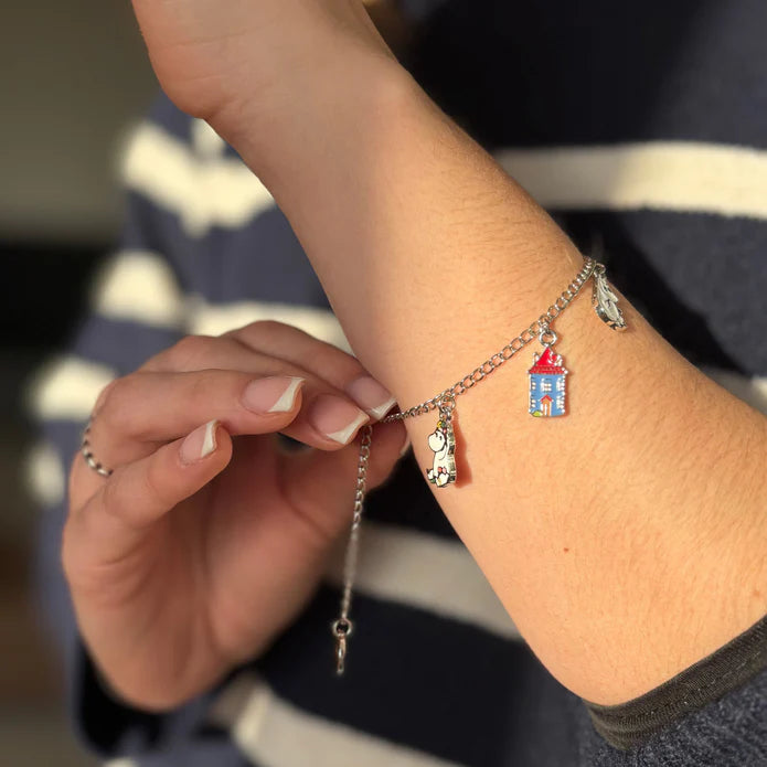 Moomin family charm bracelet worn on a wrist