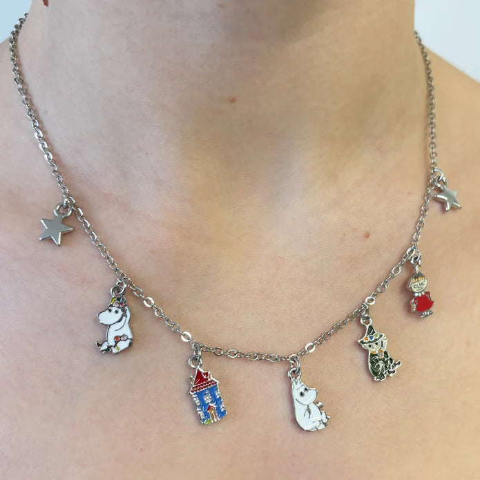 Moomin family charm necklace worn, showing Moomintroll, the Moomin house and other charms