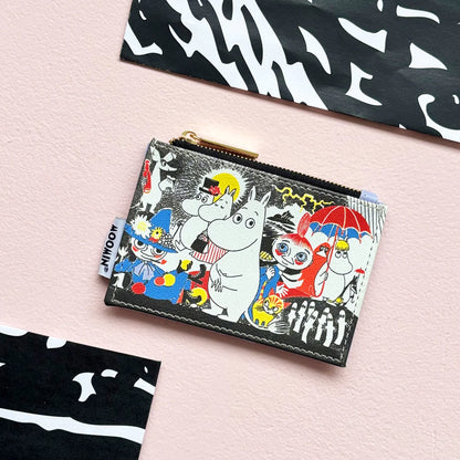 Moomin comic coin purse on a pink background