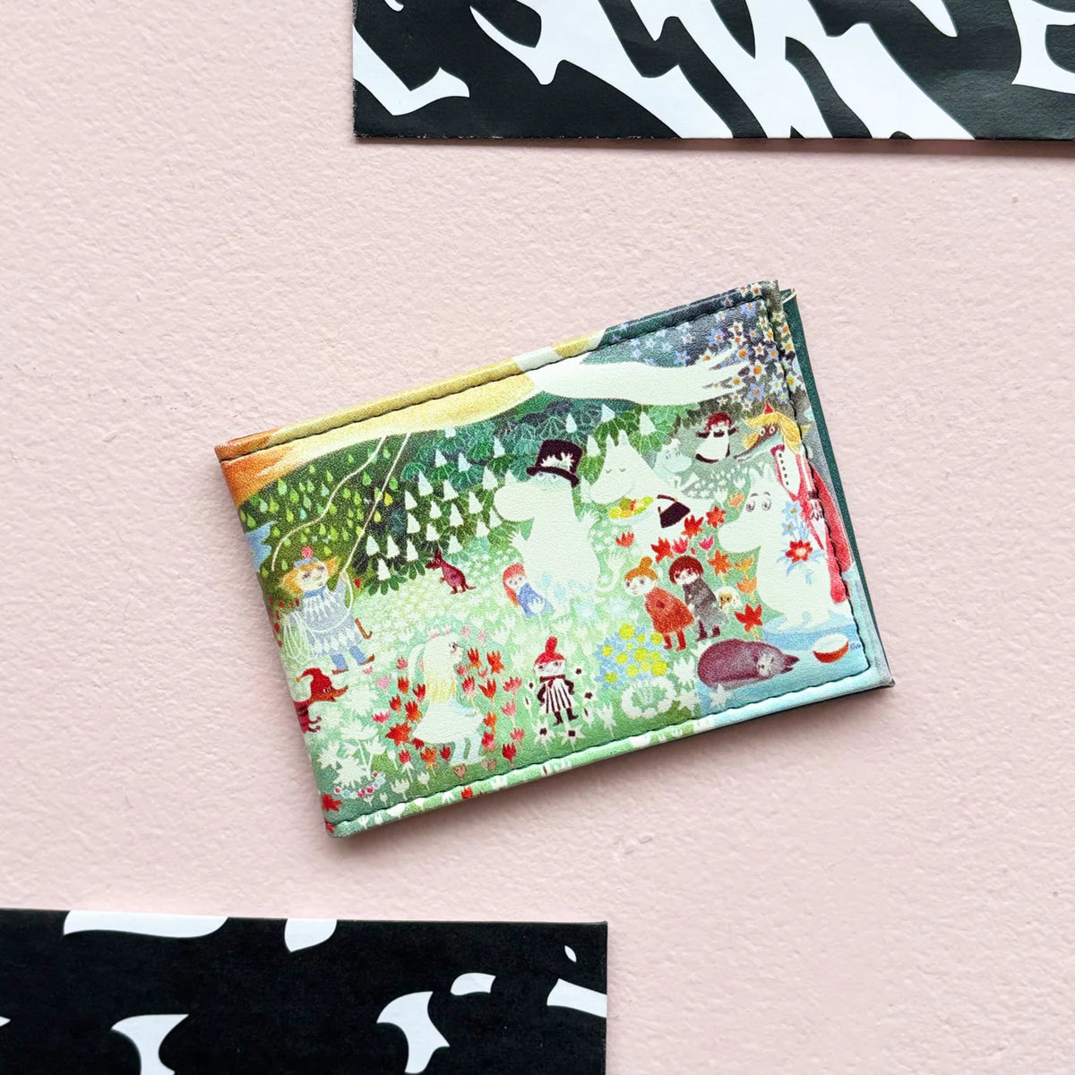Moomin Dangerous Journey travel pass holder with a colourful forest scene of Moomins