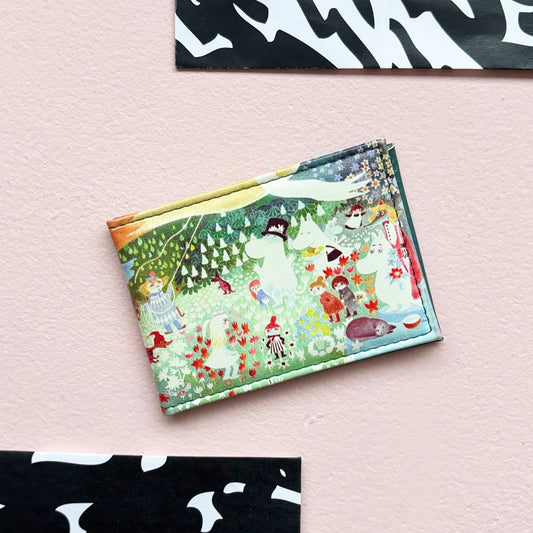 Moomin Dangerous Journey travel pass holder with a colourful forest scene of Moomins