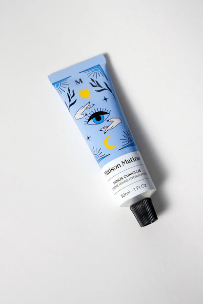Maison Matine Minus Cumulus hand cream in a blue tube with an eye illustration