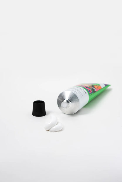 Surboom hand cream with its cap off and a dab of cream