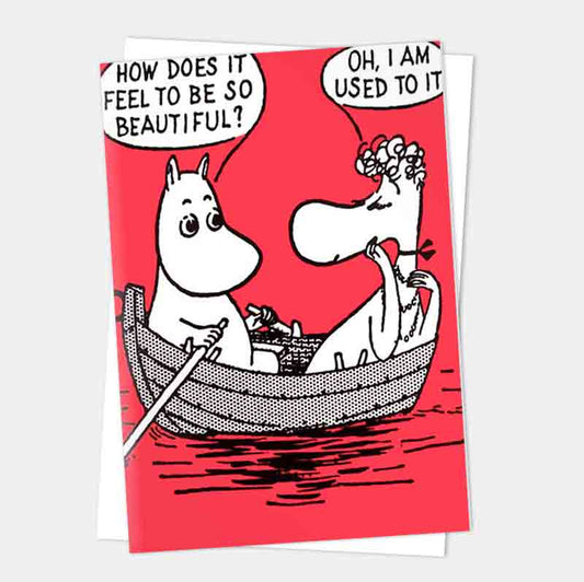 Red Moomin card of Moomintroll rowing Snorkmaiden: 'How does it feel to be so beautiful?' 'Oh, I am used to it'