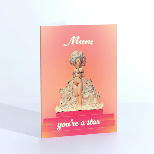 Ornament card: a vintage figurine of a woman in a frilly gown, with 'Mum, you're a star' on peach