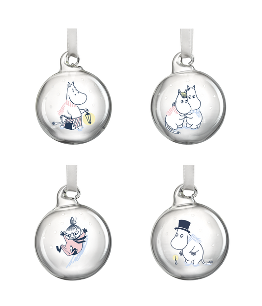 Four clear glass Moomin baubles with winter scenes
