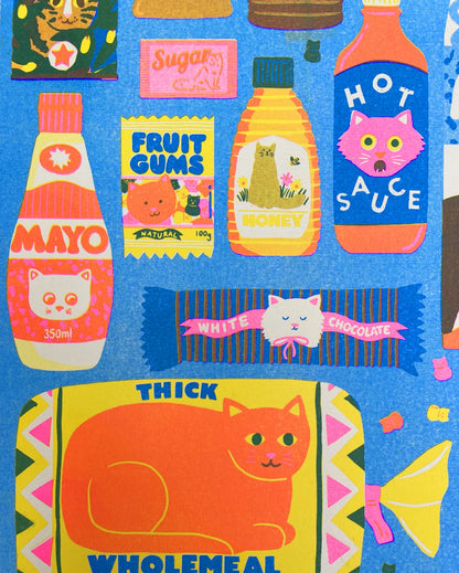 Close-up of the hot sauce and bread loaf with a cat