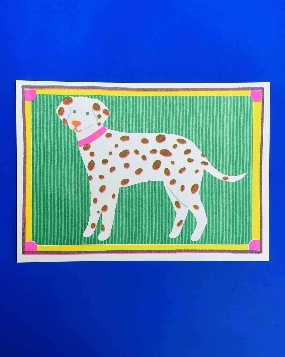Naomi Wilkinson A5 mini print: a dalmatian with a pink collar on green