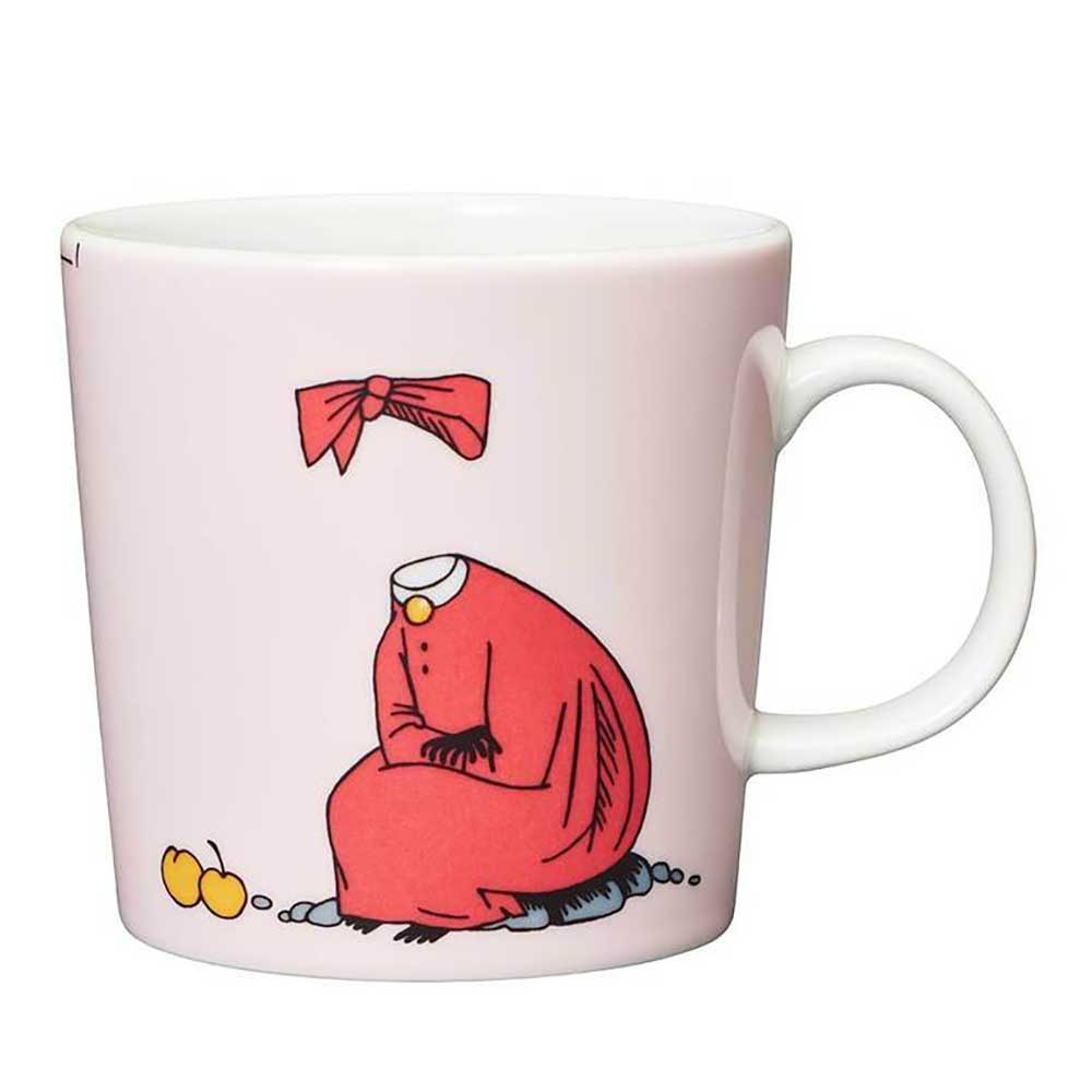Other side of the Ninny mug: Ninny sitting with two oranges, only her dress and bow visible