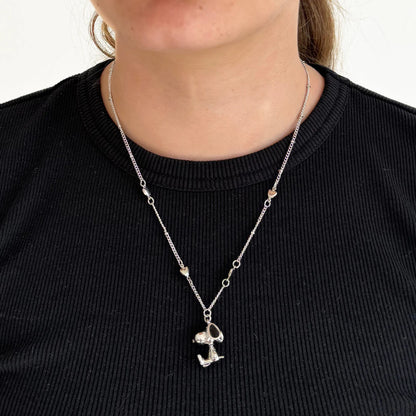Peanuts 3D necklace worn over a black top