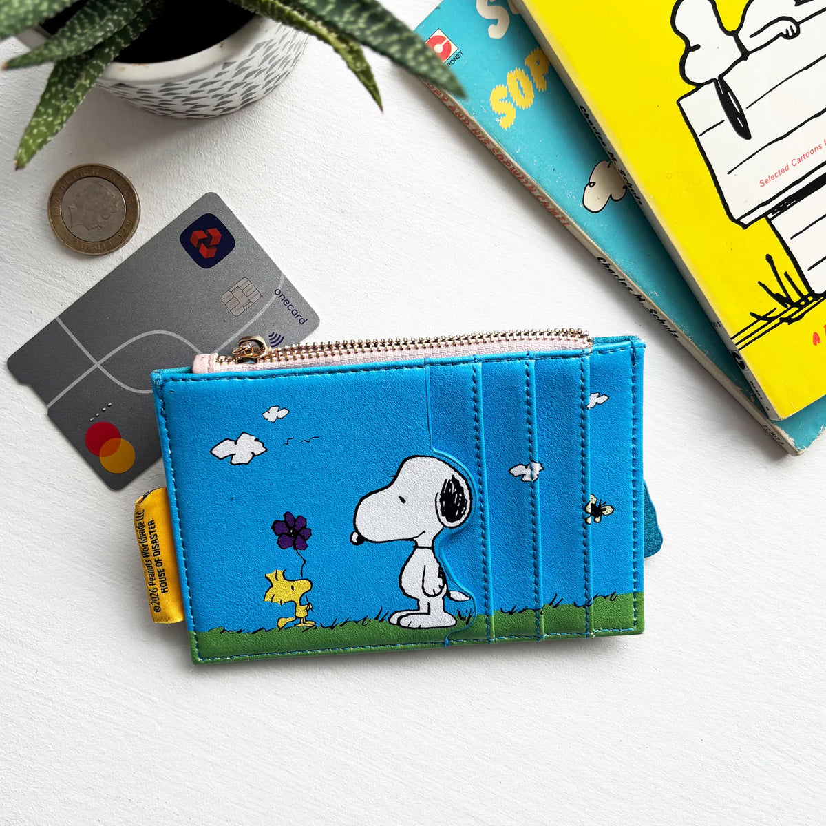 Back of the bus purse with Snoopy and Woodstock holding a flower