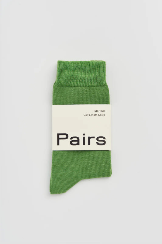Pairs merino calf-length socks in grass green, with a Pairs paper band
