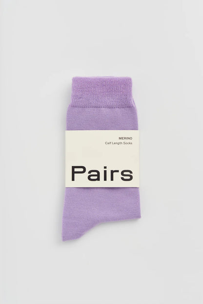 Pairs merino calf-length socks in palma violet, with a Pairs paper band