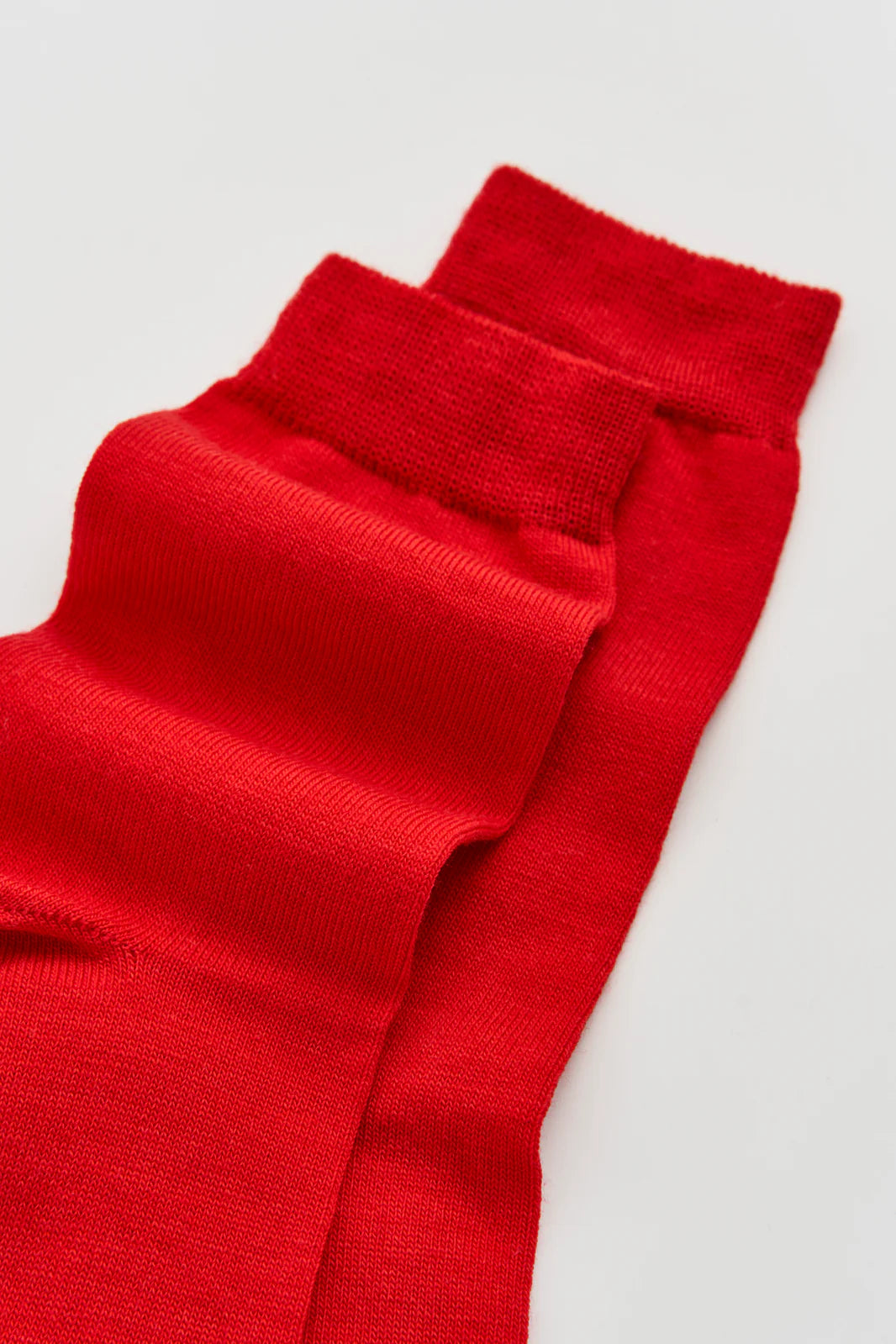 Close-up of the smooth red merino knit