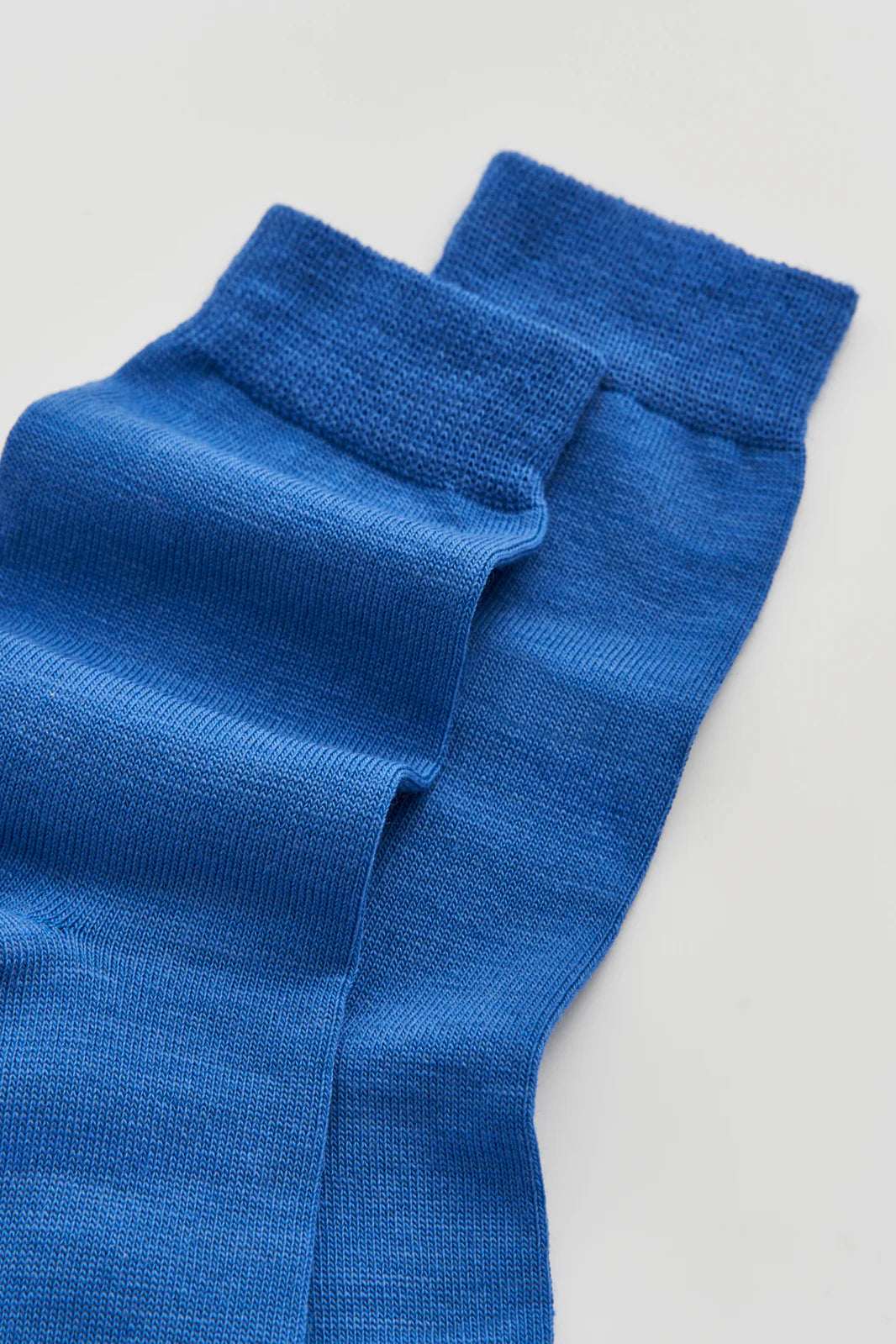 Close-up of the smooth blue merino knit
