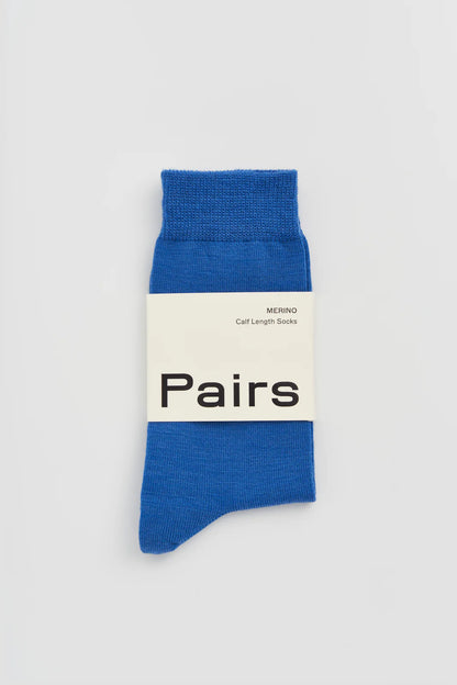 Pairs merino calf-length socks in strong blue, with a Pairs paper band
