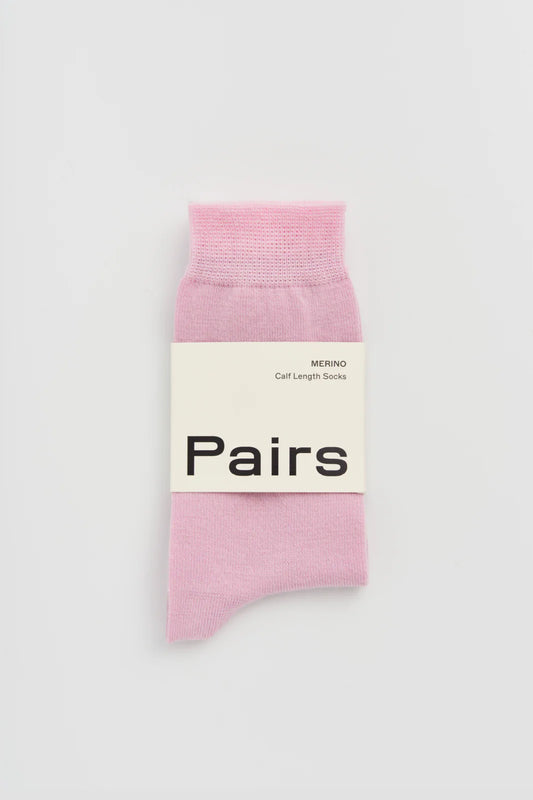 Pairs merino calf-length socks in sugar pink, with a Pairs paper band