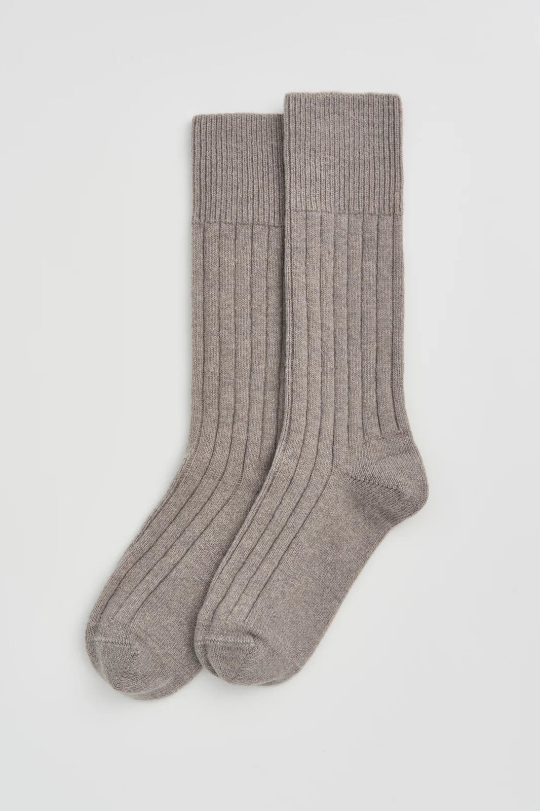 Pair of grey ribbed bed socks laid flat