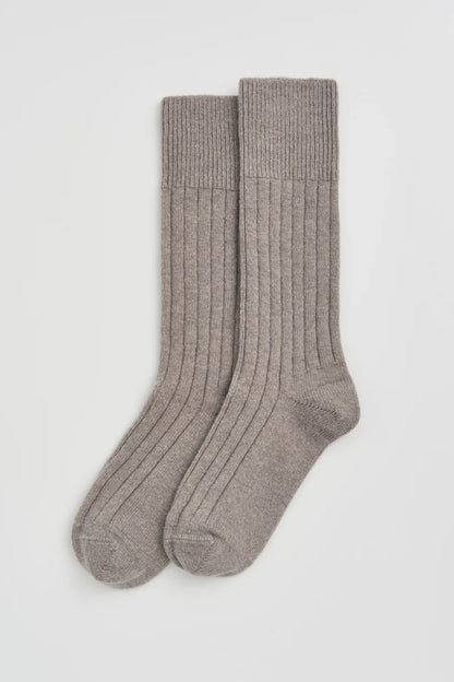 Pair of grey ribbed bed socks laid flat