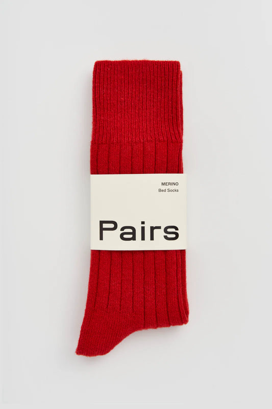 Pairs merino bed socks in postbox red, ribbed, with a Pairs paper band
