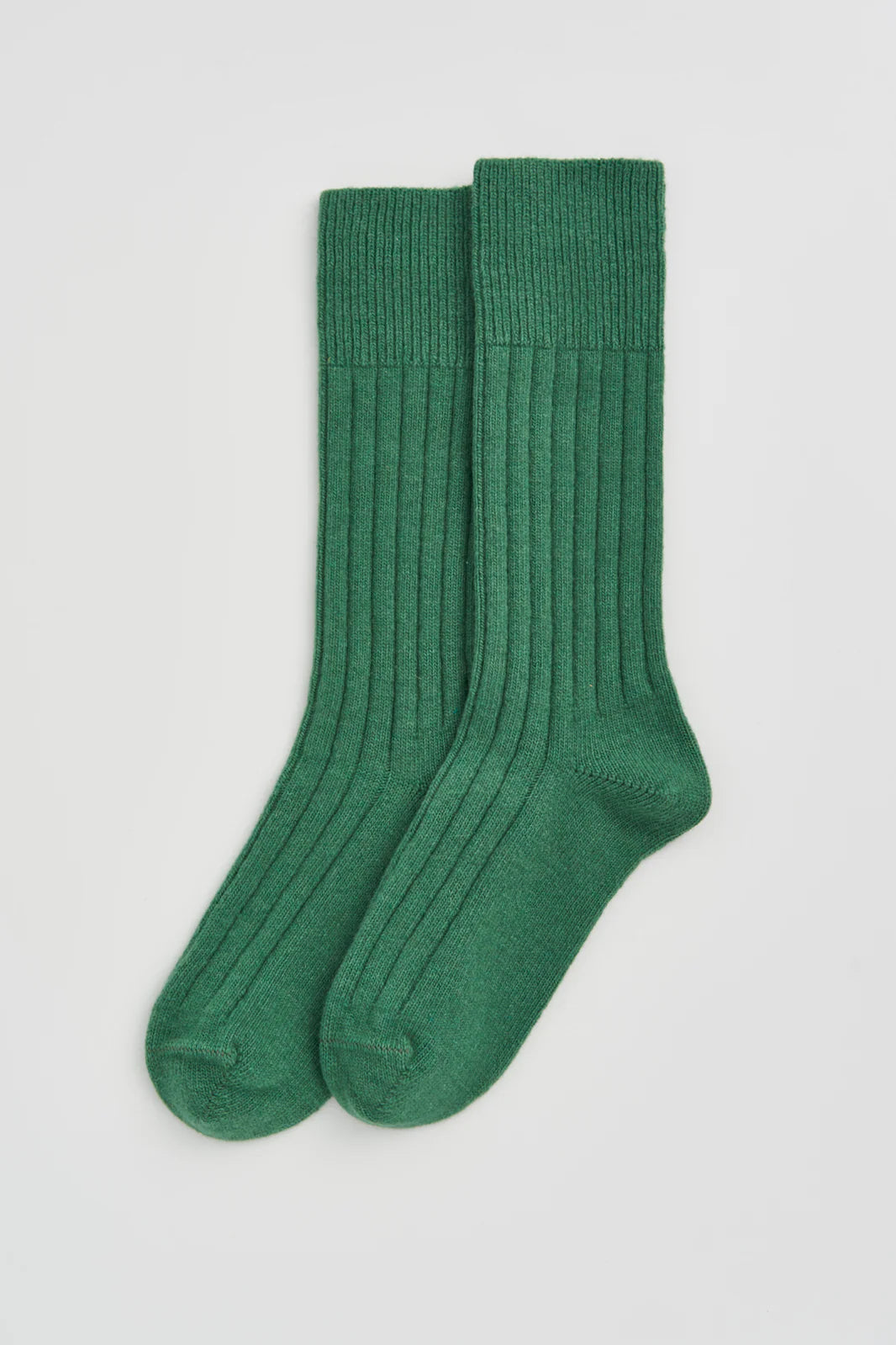 Pair of village green ribbed bed socks laid flat