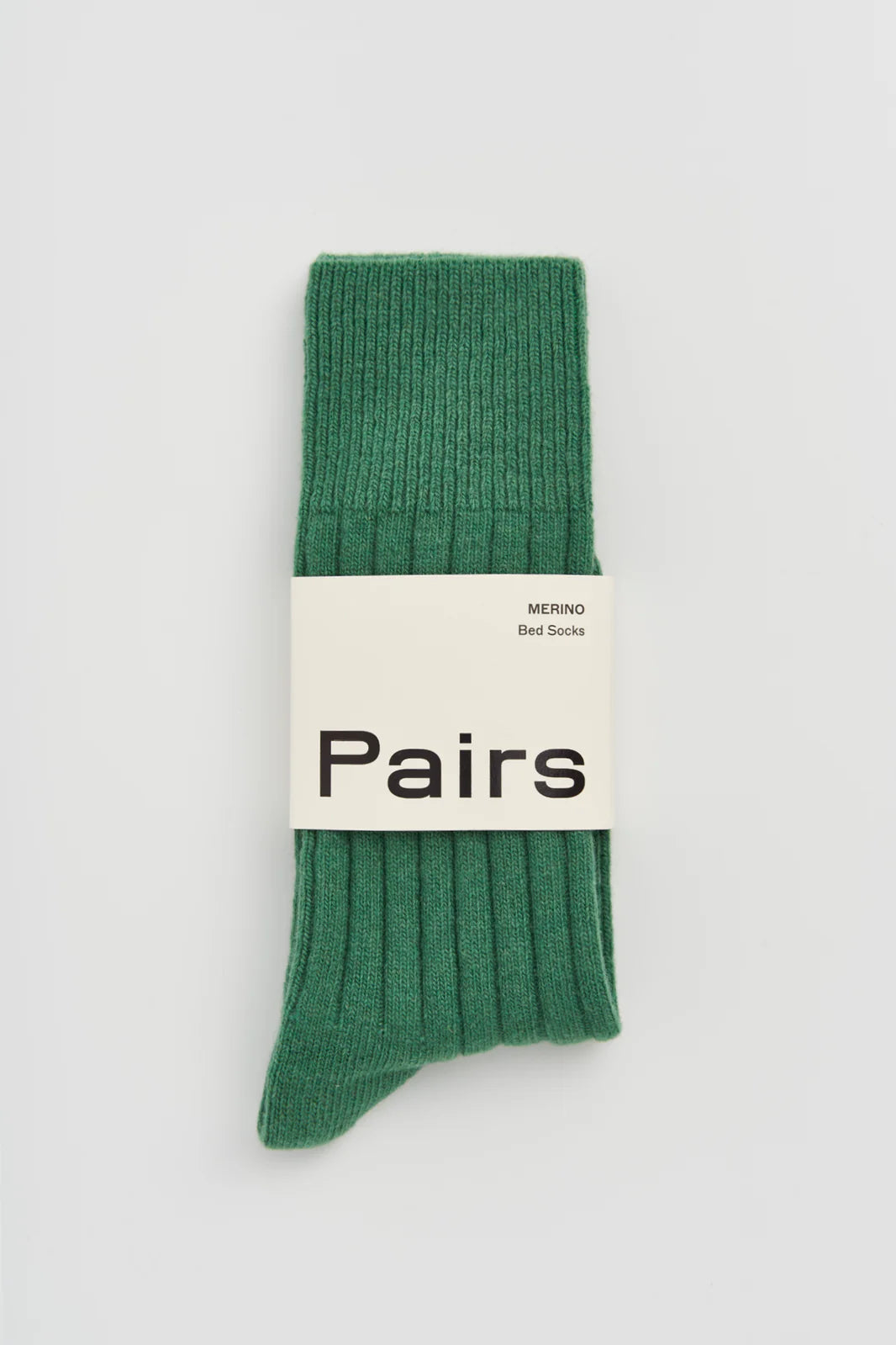 Pairs merino bed socks in village green, ribbed, with a Pairs paper band