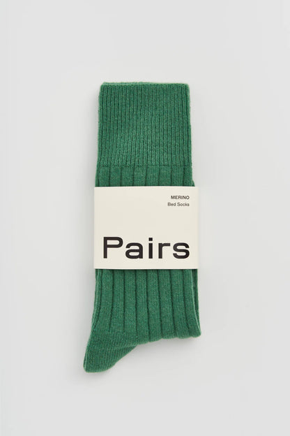 Pairs merino bed socks in village green, ribbed, with a Pairs paper band
