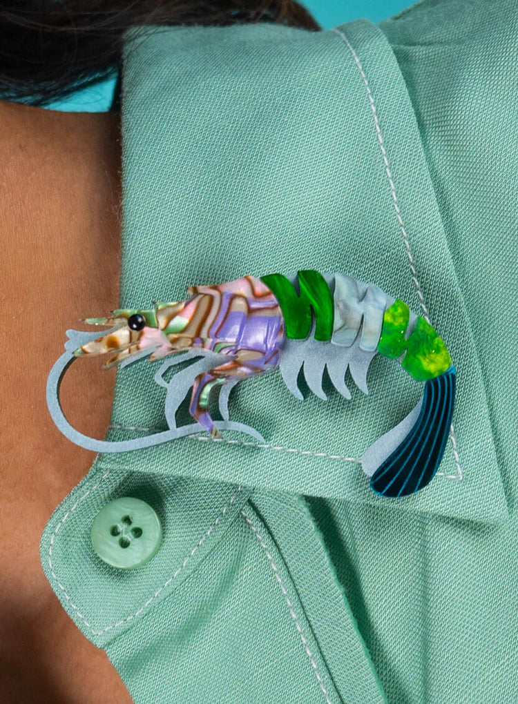 Prawn brooch worn on a mint shirt collar