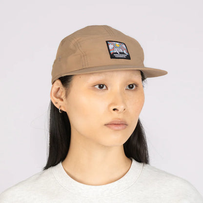 Person wearing the beige Hattifattener cap, front view