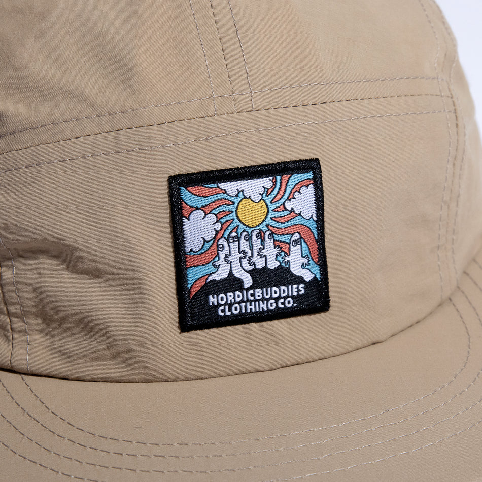 Close-up of the cap's woven patch: Hattifatteners under a sunburst, 'Nordic Buddies Clothing Co.'