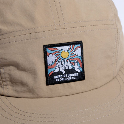 Close-up of the cap's woven patch: Hattifatteners under a sunburst, 'Nordic Buddies Clothing Co.'