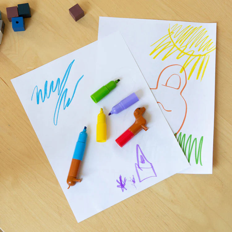 Rainbow dachshund markers on paper with drawings