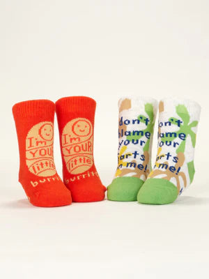 Both pairs of baby socks standing upright