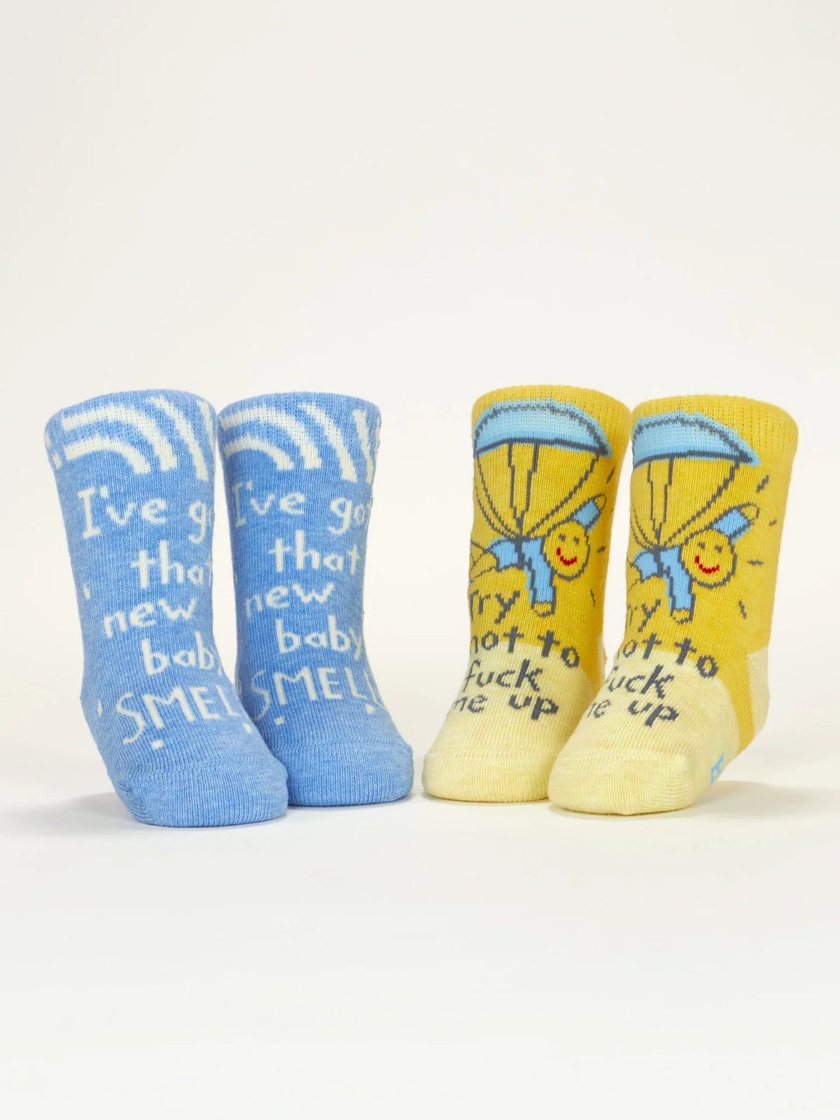Blue and yellow baby socks standing up