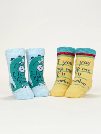 Baby socks standing up, blue dinosaur pair and yellow pair