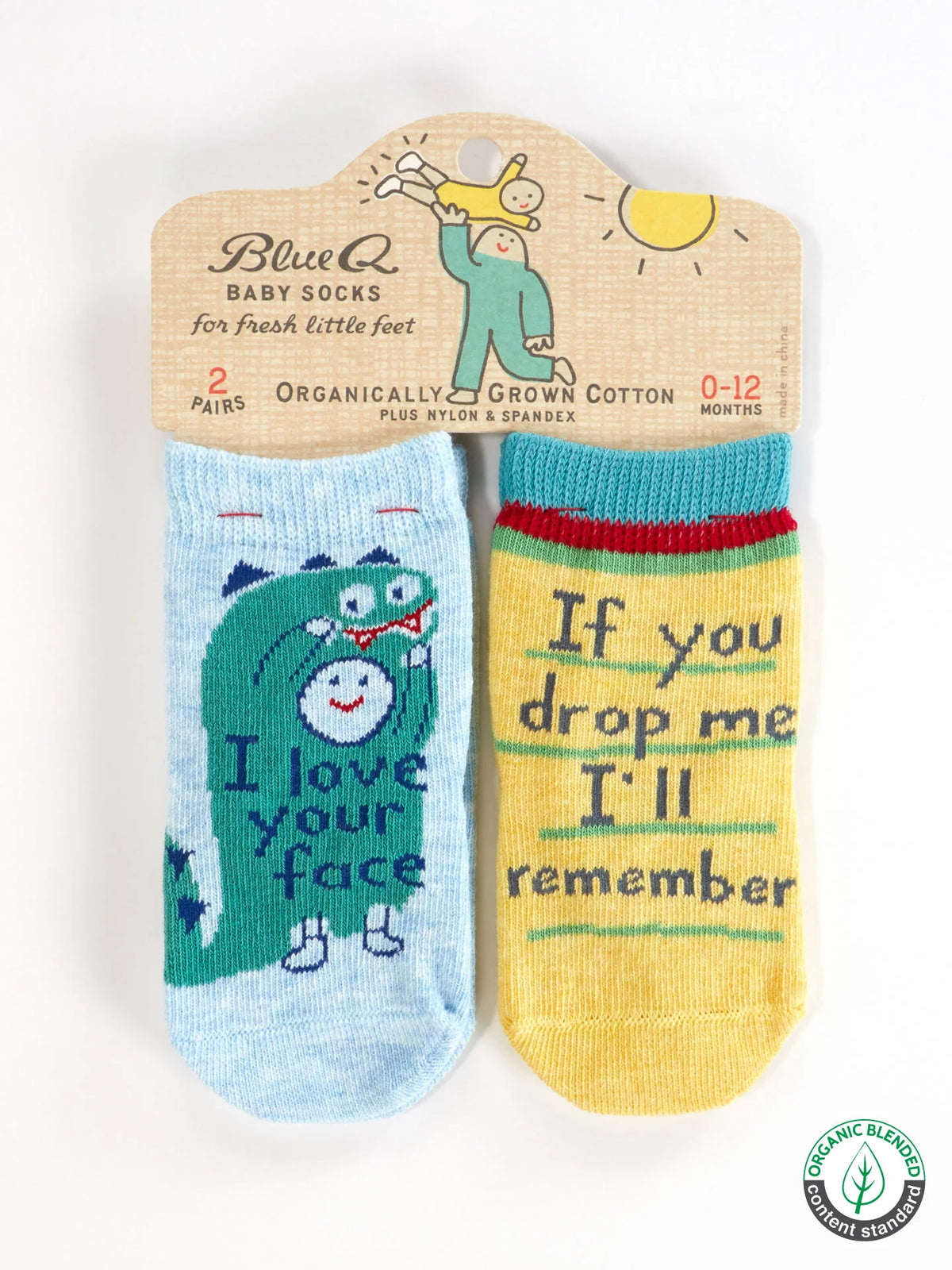 Two pairs of baby socks in packaging: I love your face with a dinosaur, and If you drop me I'll remember