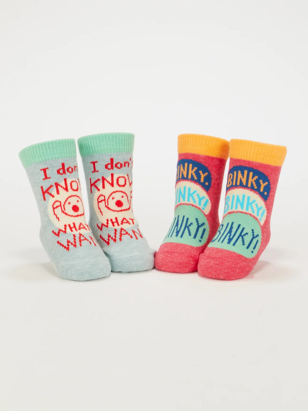 Both pairs of baby socks standing upright