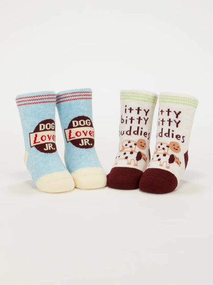 Both pairs of baby socks standing upright