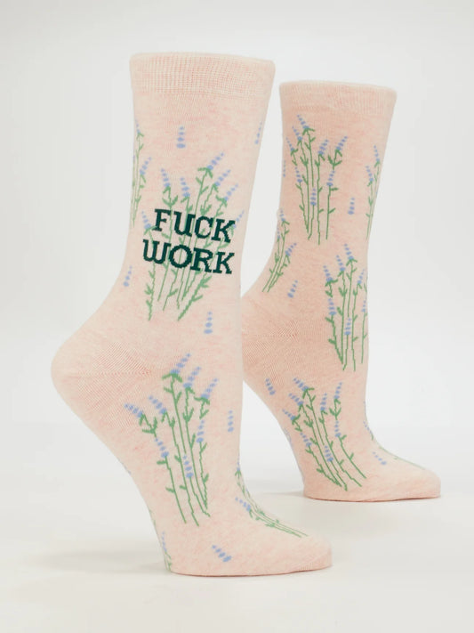 Blue Q socks: pale peach with lavender sprigs and the words 'Fuck work' in green, shown on leg forms