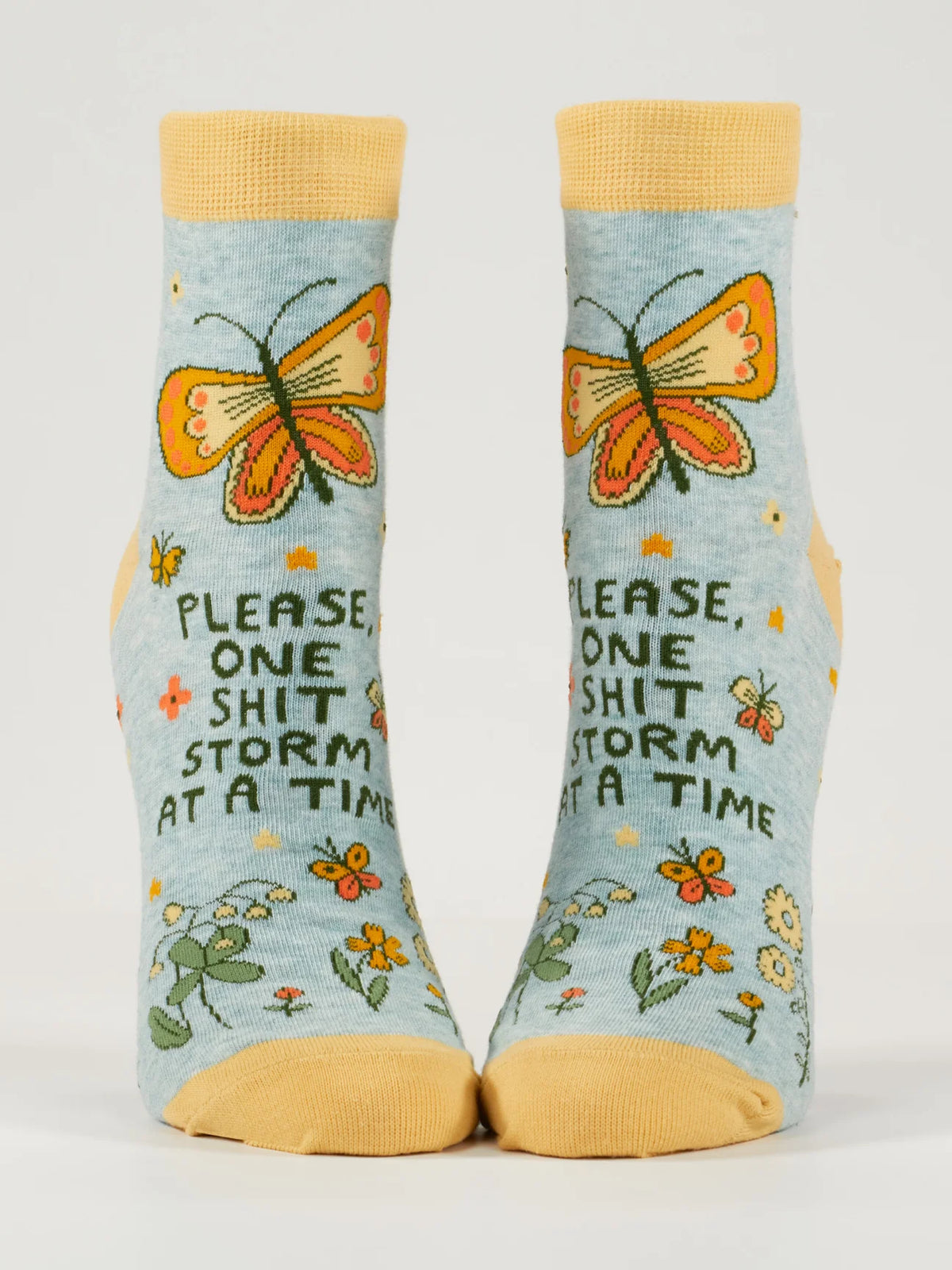 Pale blue ankle socks with orange butterflies and flowers: Please, one shit storm at a time