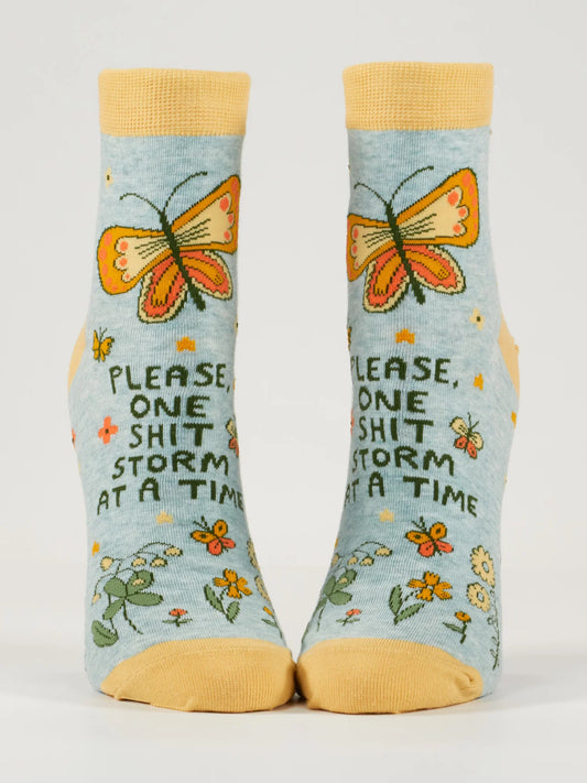 Pale blue ankle socks with orange butterflies and flowers: Please, one shit storm at a time