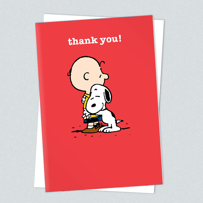 Peanuts card: Charlie Brown hugging Snoopy on red, with 'Thank you!'